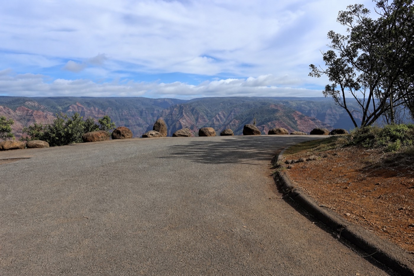 The entrance and parking area at a Waimea Canyon lookout where non-residents pay entry and parking fees