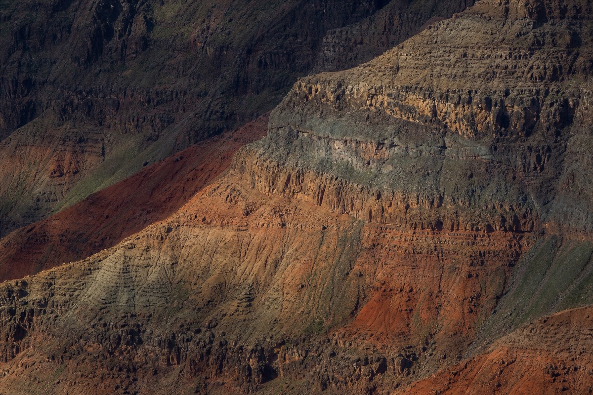 The eroded red-and-green walls of the Grand Canyon of the Pacific
